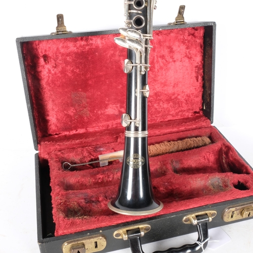 172 - A Corton clarinet, SN 609393, in hard shell case.