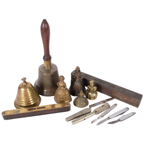 203 - A cast bell, with turned wood handle and clanger, a beehive design desk bell, a Preston and Sons ros... 