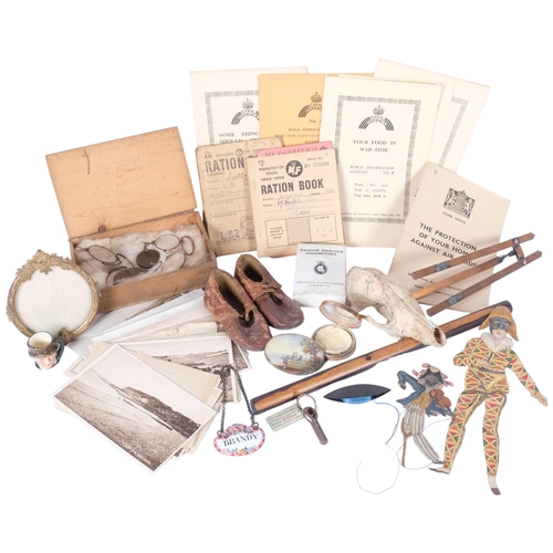 206 - A box of various items including a pair of vintage leather shoes impressed Parrot, small fox skull, ... 