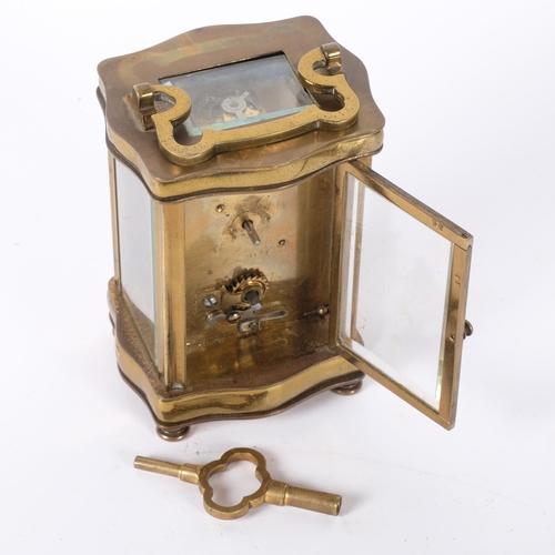 239 - A French brass cased carriage clock with white enamelled dial. H - 12cm. Complete with key.