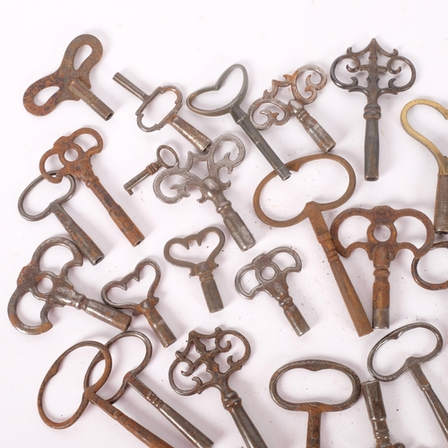 240 - A quantity of antique steel clock keys and pocket watch keys.