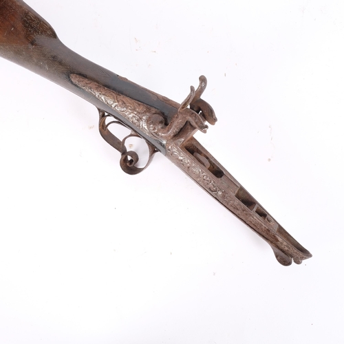 45 - A 19th century double-barrel percussion rifle stock, comprising stock trigger and hammers, L56cm