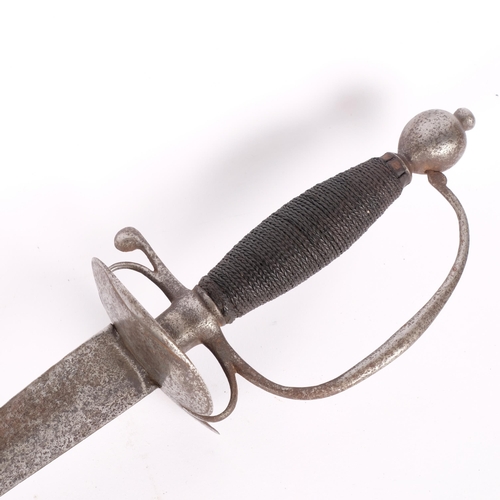 48 - An 18th century short sword with triangular blade and double shell guard. L - 100cm.