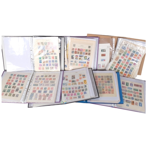 64 - 7 albums of world stamps, including Australia, Belgium, Germany, Canada etc.