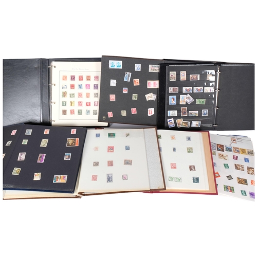 82 - A collection of world stamps in 7 albums.