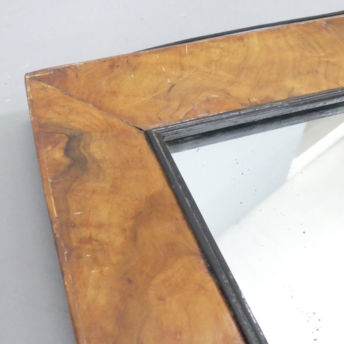 2254 - An antique walnut and ebonised framed rectangular wall mirror. 75x60cm.