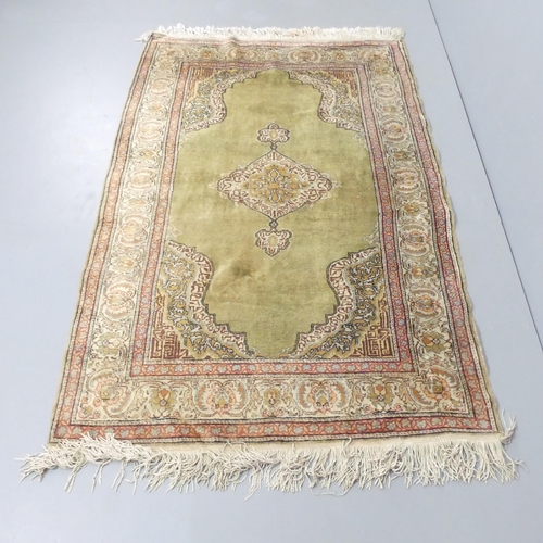 2256 - A cream-ground Herek rug. 183x122cm.