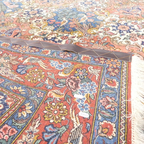 2259 - A red-ground Keshan carpet. 222x174cm