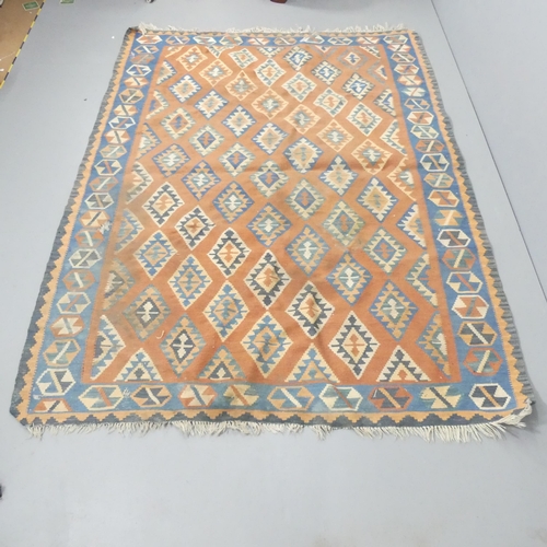 2261 - A red-ground Kilim carpet. 240x175cm