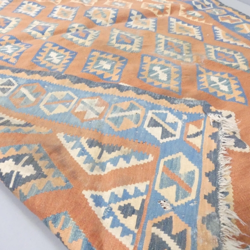 2261 - A red-ground Kilim carpet. 240x175cm