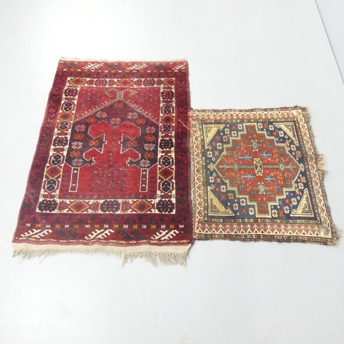 2262 - A red ground Persian mat, 112x75cm, and another. (2)