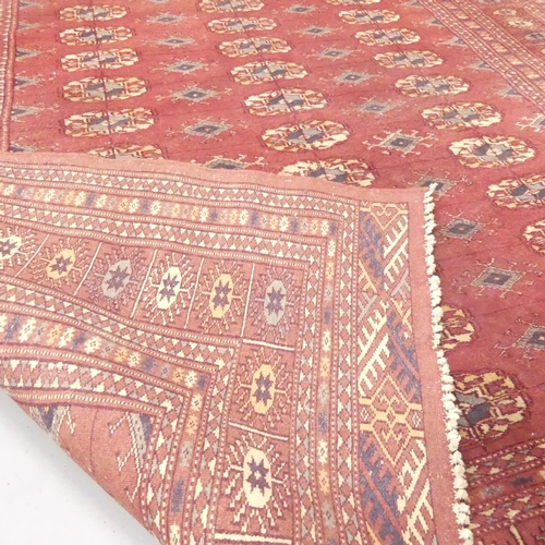 2265 - A red-ground Tekke rug. 180x127cm