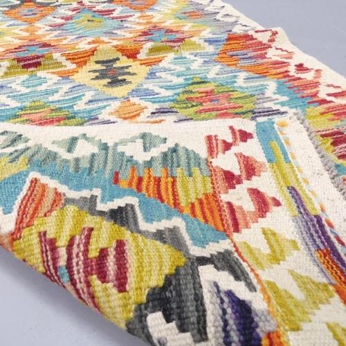 2268 - A Chobi Kilim runner. 140x66cm.