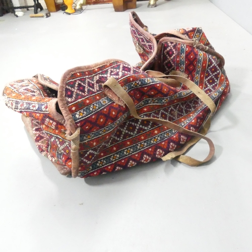 2270 - A camel saddle bag. Length 90cm.