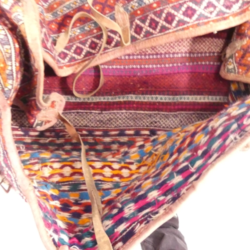 2270 - A camel saddle bag. Length 90cm.