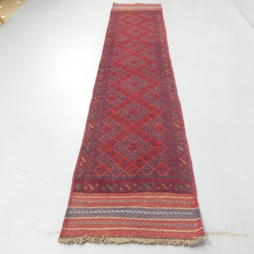 2274 - A red-ground Meshwani runner. 260x55cm