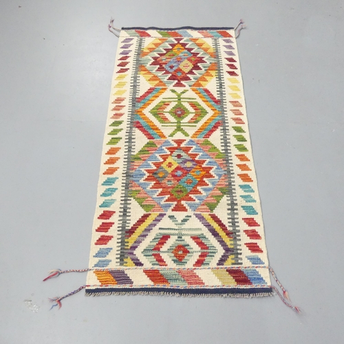 2276 - A Chobi Kilim runner. 148x64cm.