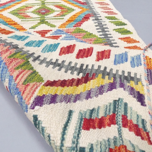 2276 - A Chobi Kilim runner. 148x64cm.