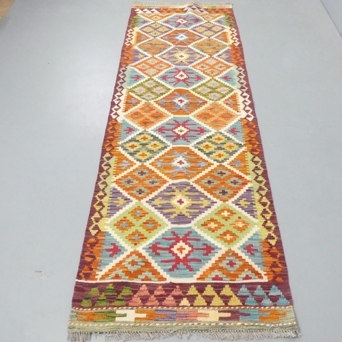 2283 - A Chobi Kilim runner. 236x80cm.