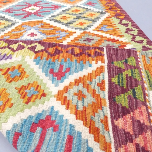 2283 - A Chobi Kilim runner. 236x80cm.