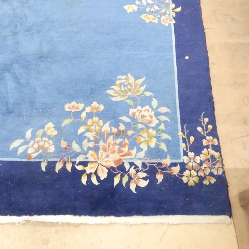 2285 - A blue ground Chinese Mandarin carpet. 318x268cm.