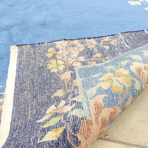 2285 - A blue ground Chinese Mandarin carpet. 318x268cm.