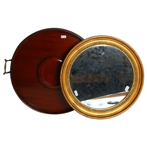 744 - A circular gilt-framed wall mirror, diameter 40cm, and an Edwardian mahogany circular 2-handled tea ... 