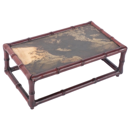 404 - An Oriental faux bamboo stand with inset stone top, 29cm across