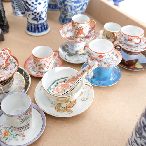 405 - A group of Oriental porcelain decorative cups and saucers, etc