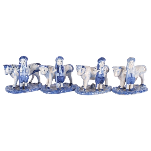 462 - Delft blue and white faience pottery bull and farmer, length 14cm, and 3 similar figures, and 2 faie... 