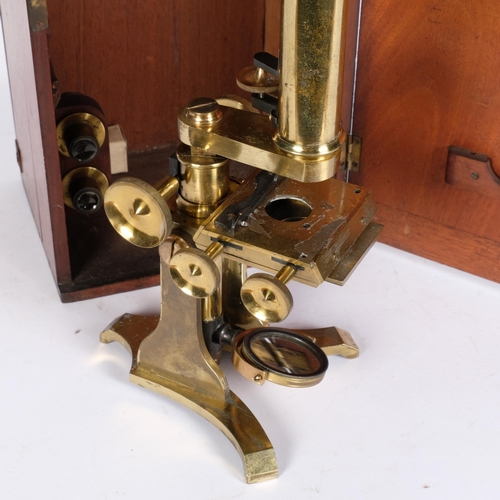 465 - A brass student's microscope with accessories, in fitted mahogany case, H39cm