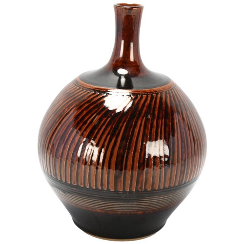 472 - Leo Francis Matthews (b.1962) a tenmoku glaze stoneware bottle vase, makers mark to base, height 24c... 