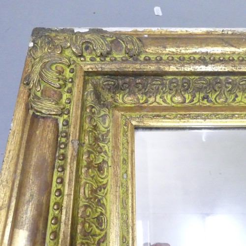 2251 - A gilt-painted continental style bevel edged wall mirror. 87x118cm.