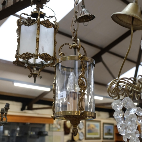 419 - Hexagonal brass hanging lantern, with etched frosted panels, a cylindrical brass lantern, and a smal... 