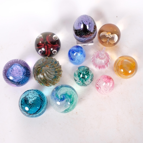 430 - A group of 12 Caithness paperweights, including moonflower and cauldron