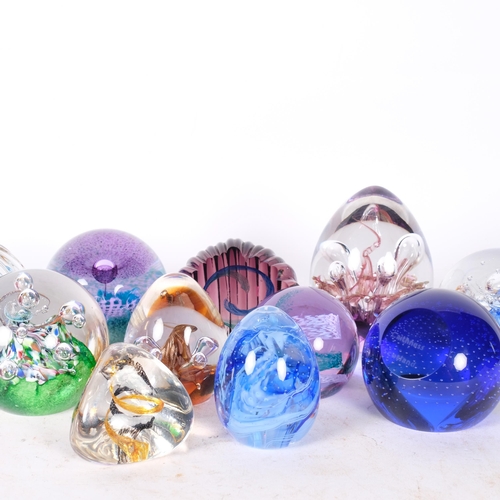 434 - A group of 12 Caithness glass paperweights, tallest moonflower echoes, 10.5cm