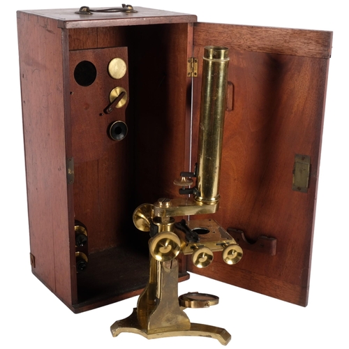 465 - A brass student's microscope with accessories, in fitted mahogany case, H39cm