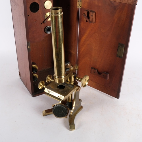 465 - A brass student's microscope with accessories, in fitted mahogany case, H39cm