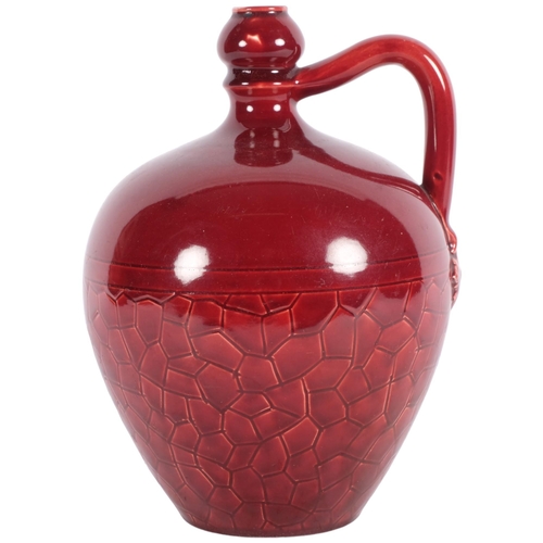 467 - A red glazed pottery flagon with incised crazing paving design, signed, H20cm