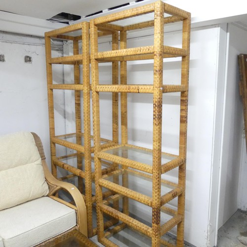 2499 - A pair of contemporary rattan shelving units with inset glass shelves, 70x199x40cm,
and a matching c... 