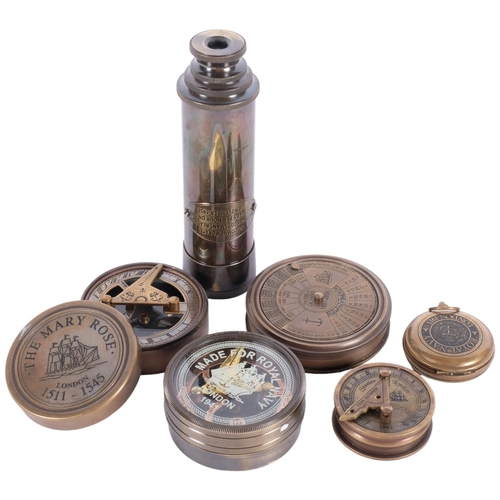 482 - A reproduction brass telescope, compass, perpetual calendar, 7.5cm across, etc