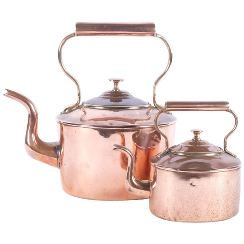 486 - 2 graduated Victorian copper kettles, tallest 31cm