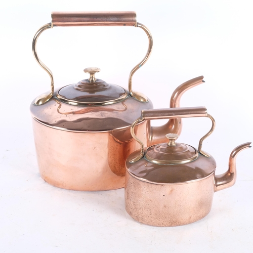 486 - 2 graduated Victorian copper kettles, tallest 31cm