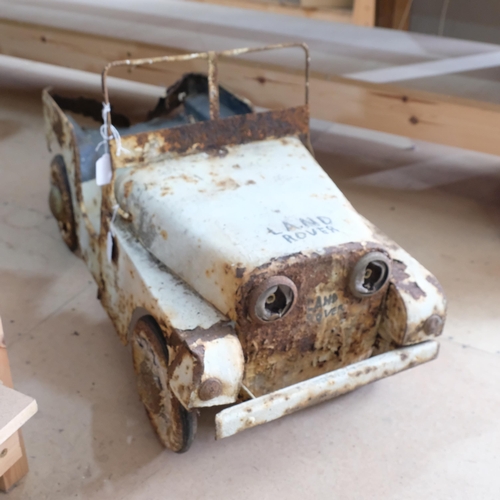 500 - An early steel painted child's painted pedal operated Land Rover, in play-worn condition