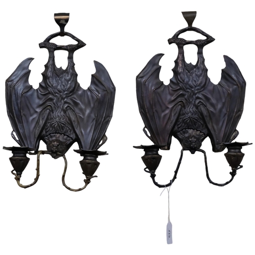 512 - A pair of patinated cast brass bat design 2-branch wall sconces. L - 35cm.