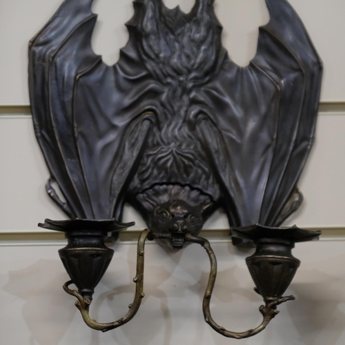 512 - A pair of patinated cast brass bat design 2-branch wall sconces. L - 35cm.