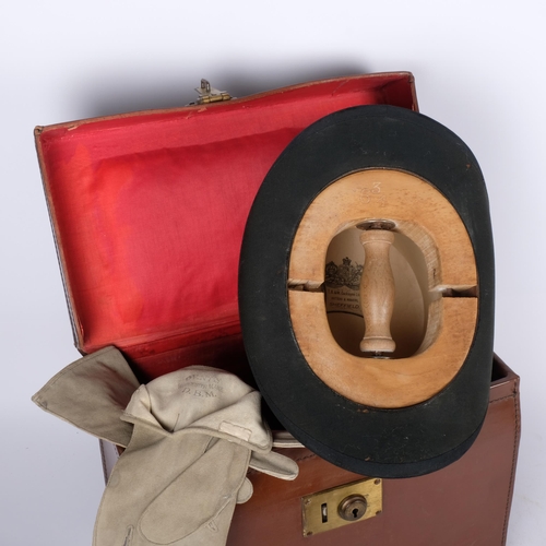 267 - Antique leather hat box with brass lock, containing a top hat by Cockayne of Sheffield, size 6 and 3... 