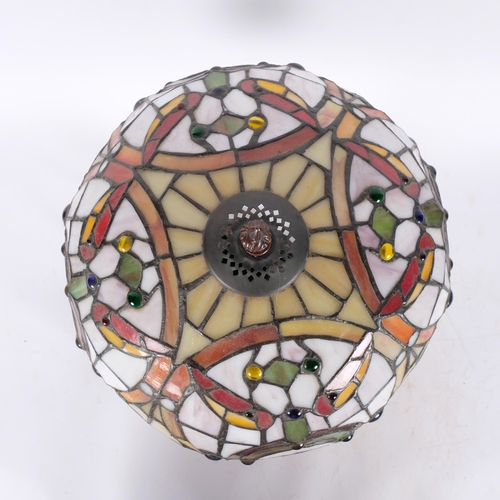 278 - A Tiffany style table lamp on cast-metal base, with multi-coloured shade, H42cm