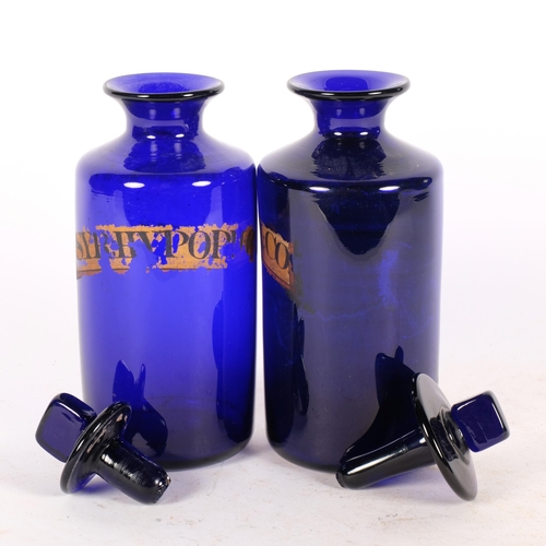 289 - A pair of 19th century Bristol blue glass apothecary jars, with original labels, H19cm including sto... 