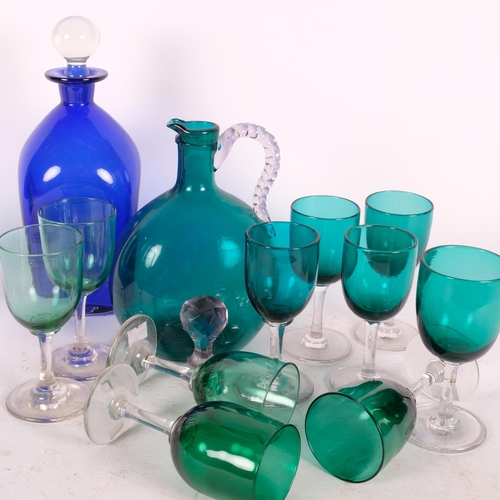 295 - A Bristol blue decanter with stopper, 24cm, a green glass Claret jug, and 12 green wine glasses